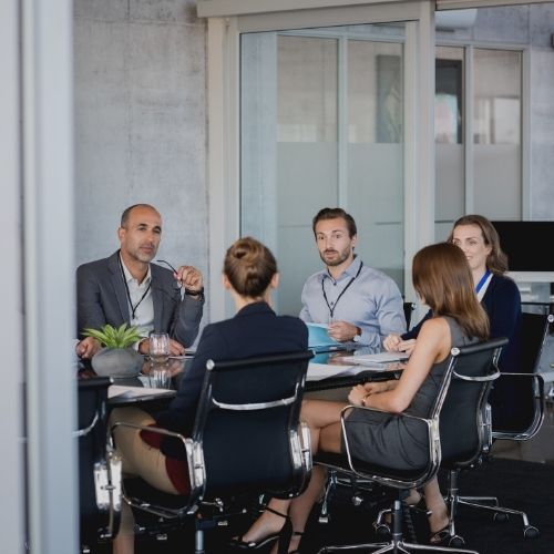 group of people meeting in conference room