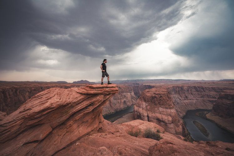 man at the edge of a canyon
